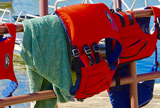 Image of life jacket preservers on a fence near the beach of Tulalip Bay