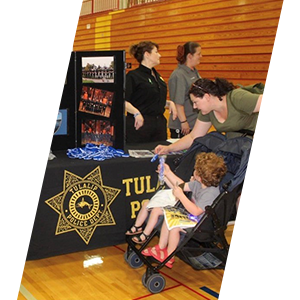 Officer at school function for kids sliding header image. 