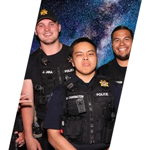 Sliding header image showing three officers smiling