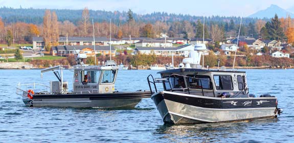 Tulalip Tribal Police Department Fish & Wildlife mobile image of patrolling boats in the bay. 