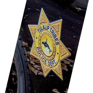 Tulalip Tribal Police Department badge on side of patrol car header sliding image.