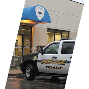 Tulalip Tribal Police Department header sliding image of patrol car at the entrance of police department header sliding image.