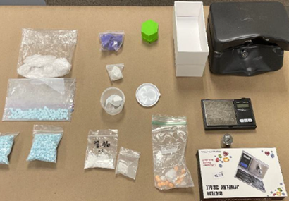Illegal narcotics laid out on TPD's table seized by detectives, including Fentanyl powder, Fentanyl pills, and Methamphetamine as well as cocaine. 