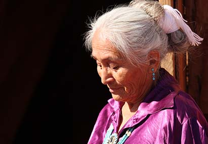 A tribal elder is dejected after a caller scammed her into believing that someone they loved was in trouble. 
