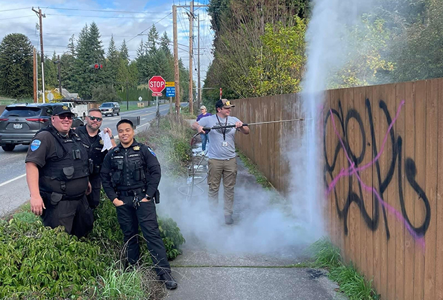 A Tulalip Police Department officer, teaching self-defense to a woman. 